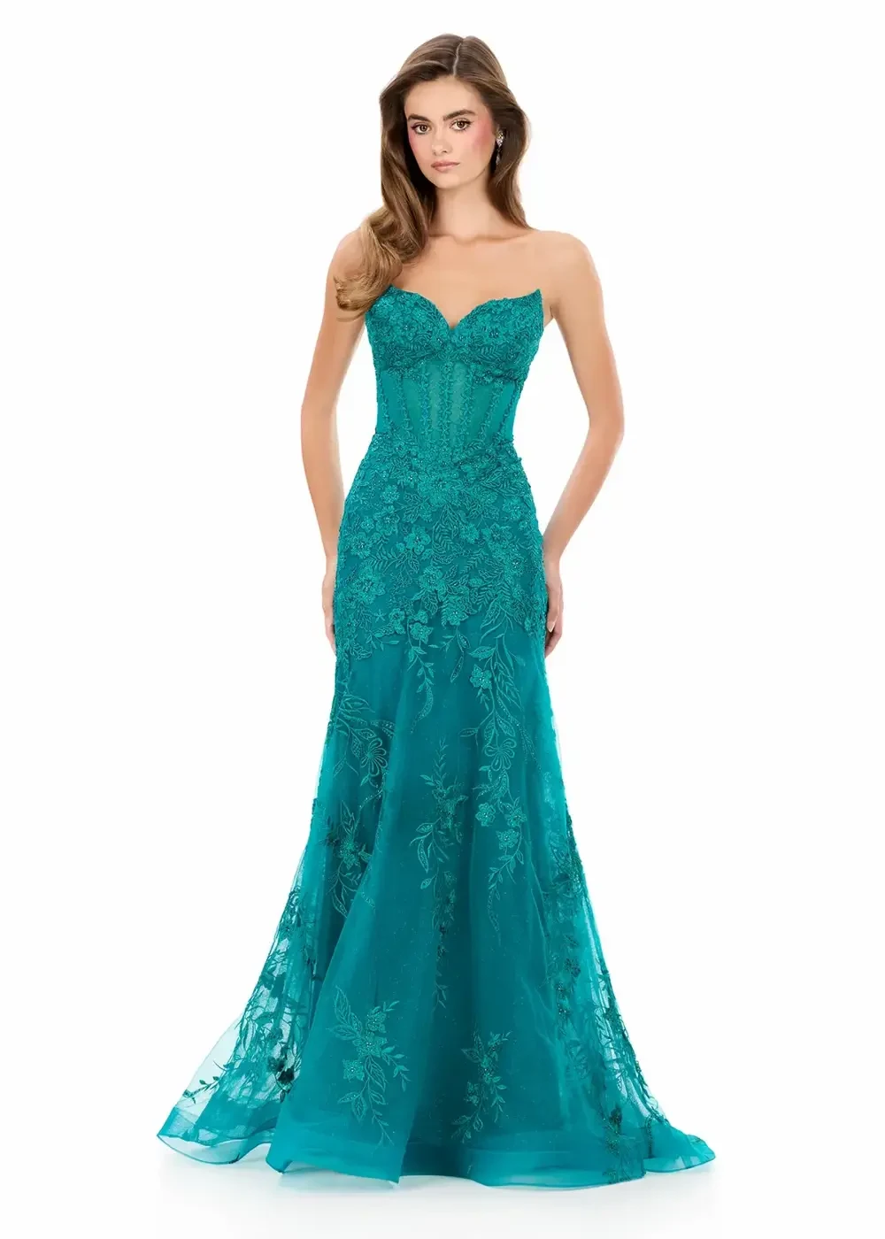 model is wearing a sleeveless green prom dress
