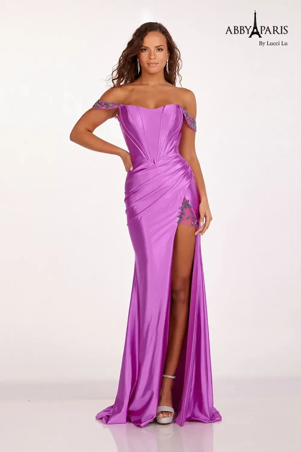model is wearing a sleeveless pink prom dress