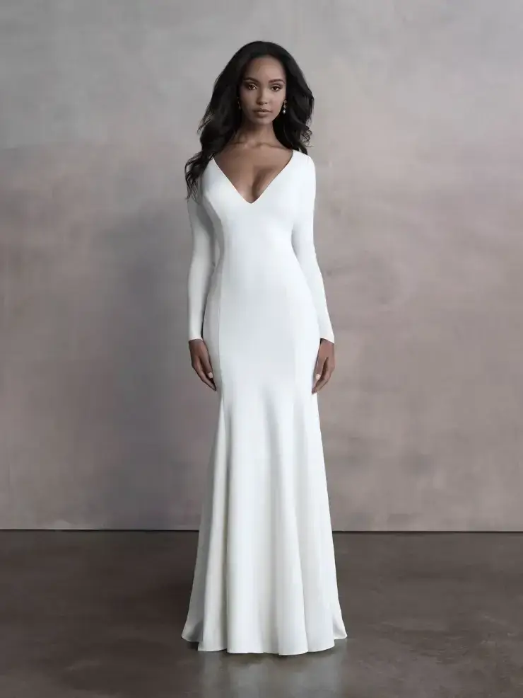 model is wearing a long sleeve fit and flare minimalist wedding gown