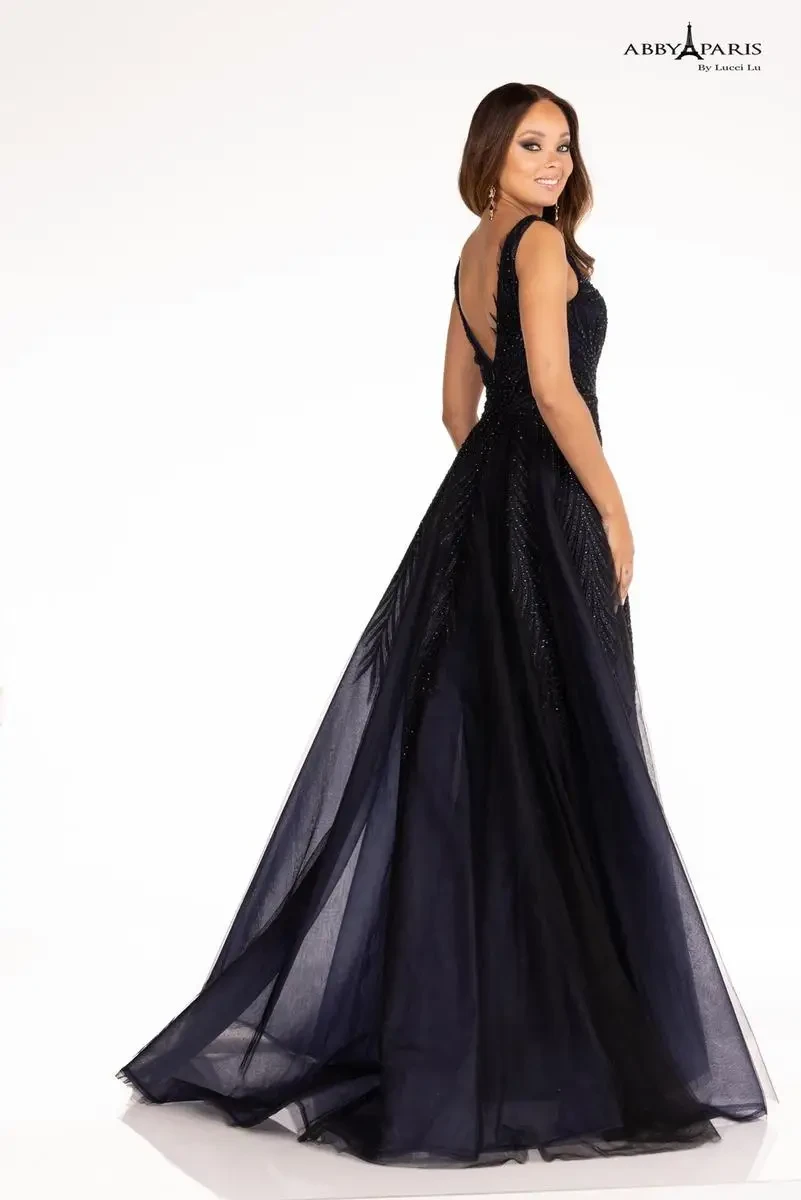 model is wearing a sleeveless navy blue prom dress