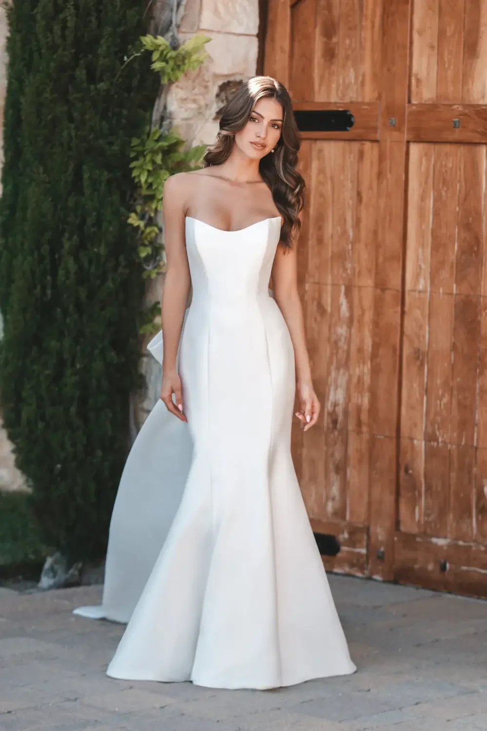 model is wearing a strapless bridal gown