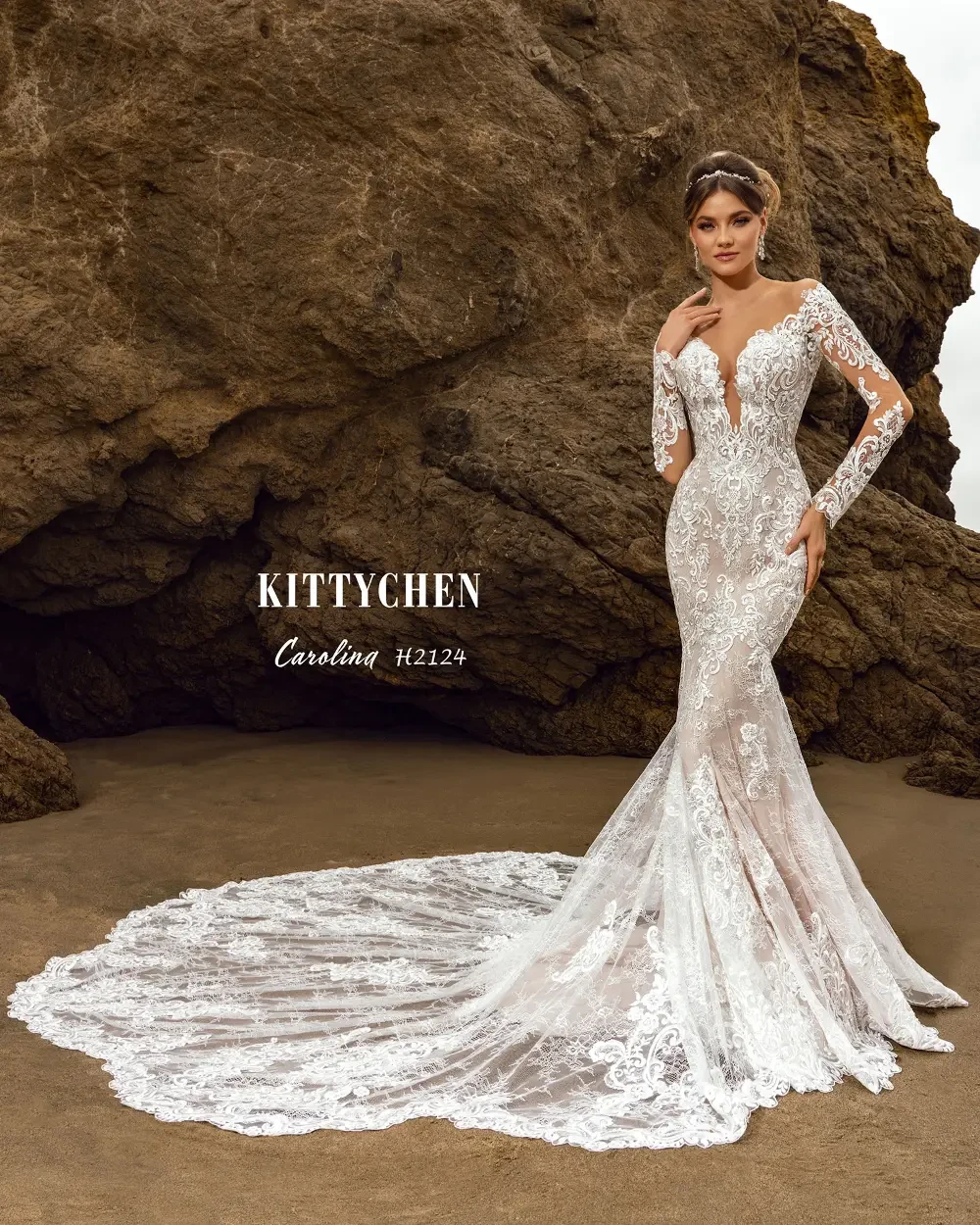 model is wearing a lace long sleeve bridal gown