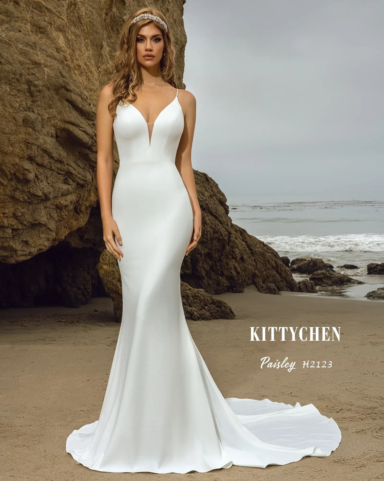 model is wearing a sleeveless fit and flare minimalist wedding dress