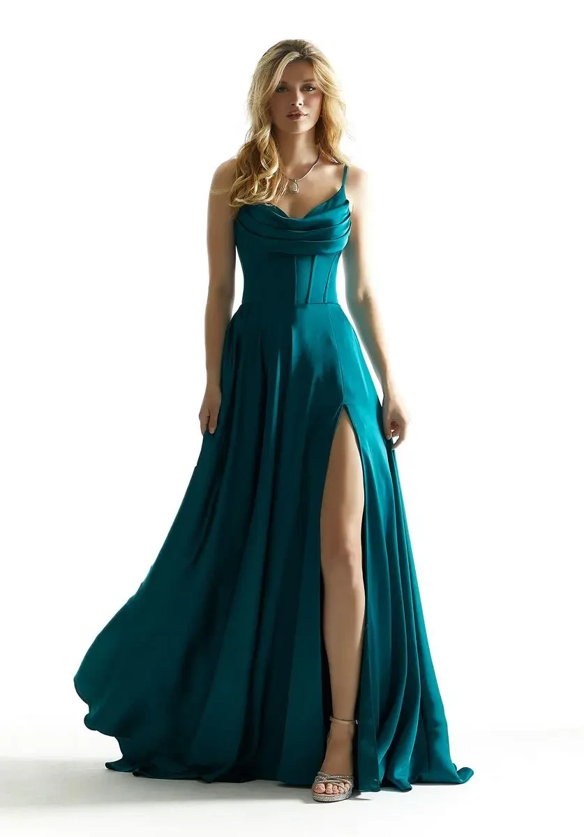 model is wearing a sleeveless green a-line prom dress